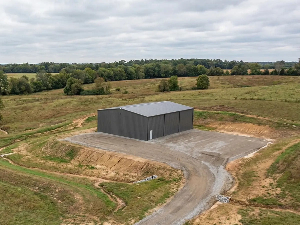 Steel building installed on rural site showing grading and drainage coordination in Canada